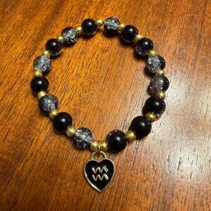 Black and Gold Beaded Bracelet with Aquarius Zodiac Charm